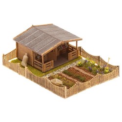 Jardín pequeño fuera de la ciudad con una gran casa de jardín 180493 Faller Escala H0